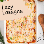 Overhead shot of a fully baked Lazy Lasagna in a white baking dish, topped with melted, golden cheese and sprinkled with chopped parsley. Surrounding the dish are bowls of fresh salad, breadsticks, and a small bowl of grated Parmesan.
