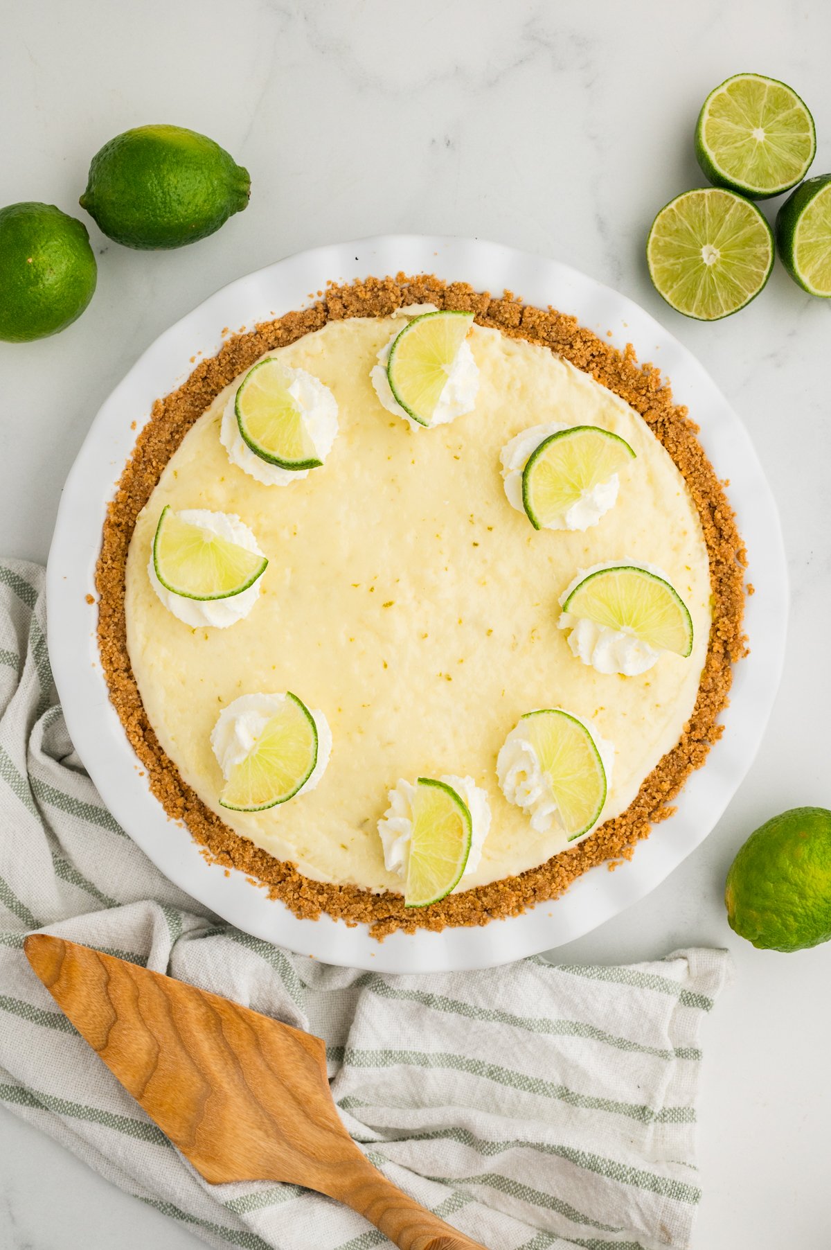 Full Lime Chiffon Pie with lime wedges