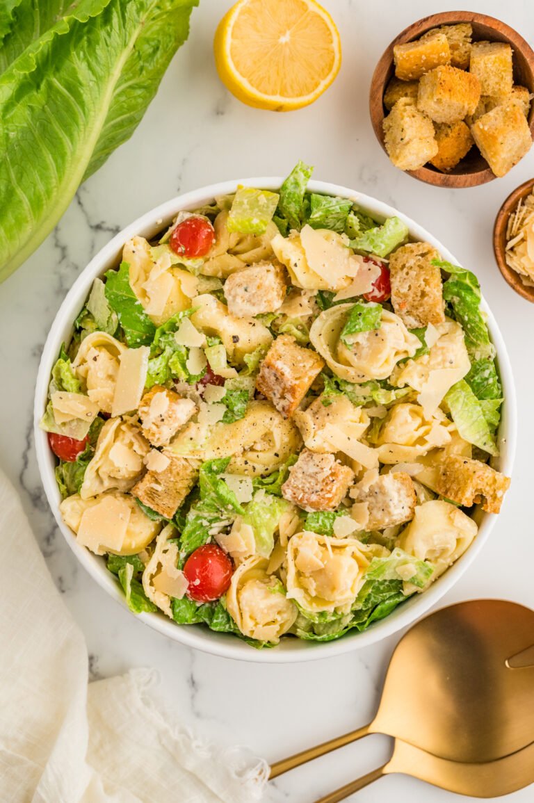 Tossed tortellini Caesar salad with romaine lettuce, parmesan, croutons, and cherry tomatoes.